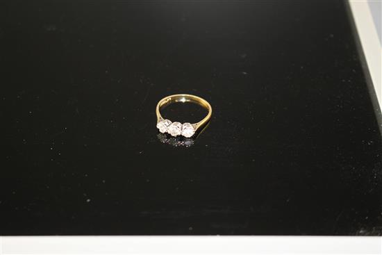 An 18ct and Plat, three stone diamond ring, size P, gross weight 1.8 grams,